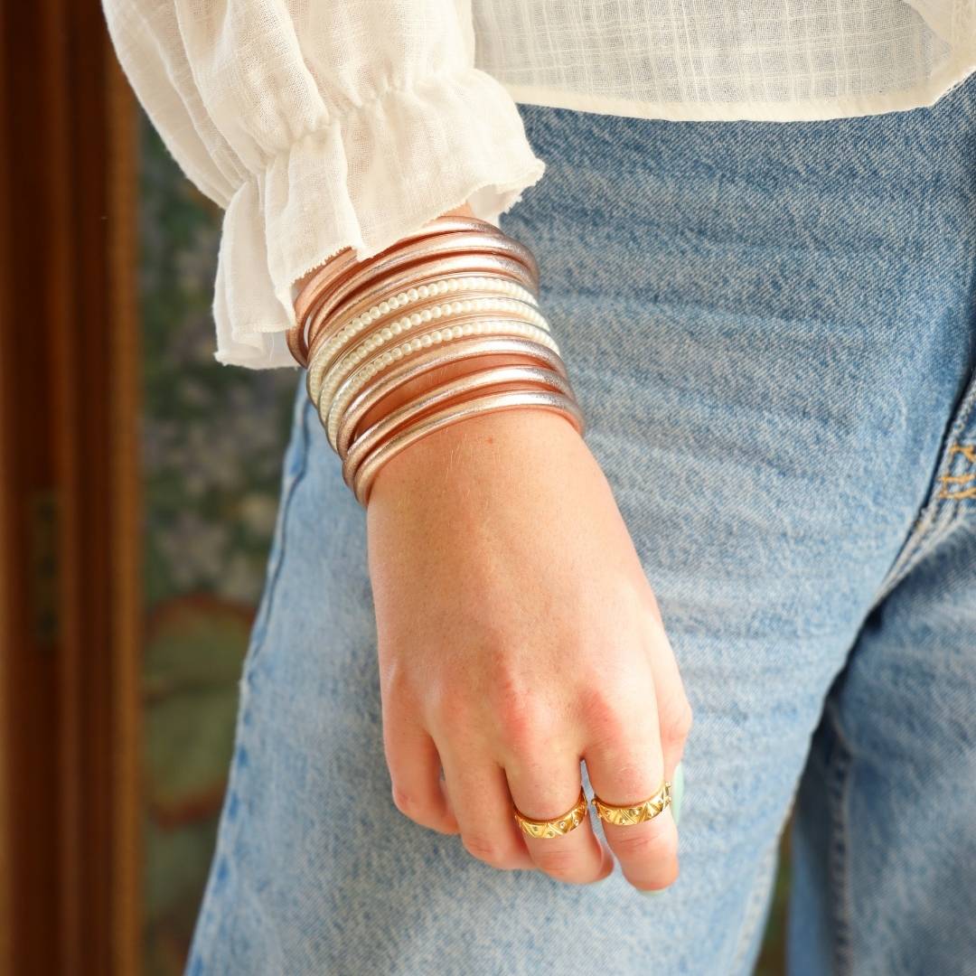 Champagne and Pearl Three Queens All Weather Bangle Bracelets on Model Wearing a White Blouse and Blue Jeans | BuDhaGirl